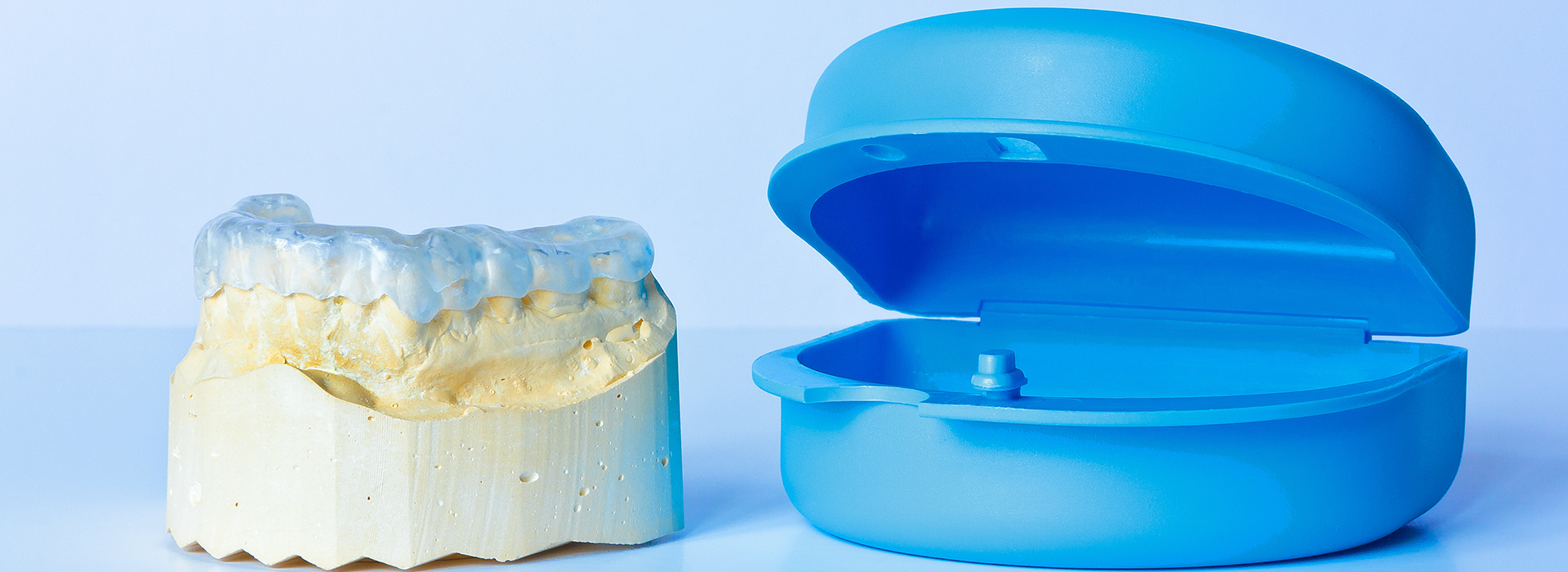 The image shows a collection of dental implants, including a close-up view and an angled perspective, against a white background.